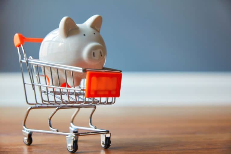 Piggy bank in shopping trolley