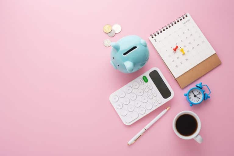 piggy bank, calculator, coffee, calendar, alarm clock and pen