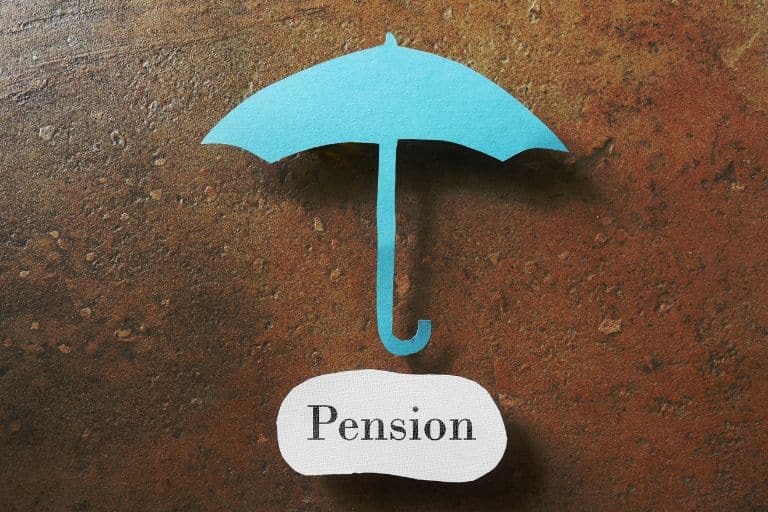 turquoise umbrella over pension sign