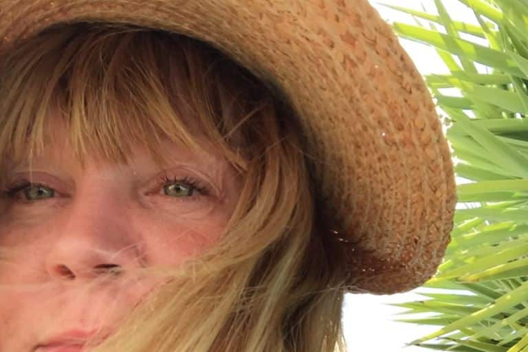 woman in straw hat green eyes